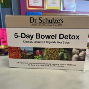 A box of Dr. Schulze's Bowel Detox, made with vegan and organic ingredients, sits on a counter with details and kit contents shown on the packaging.